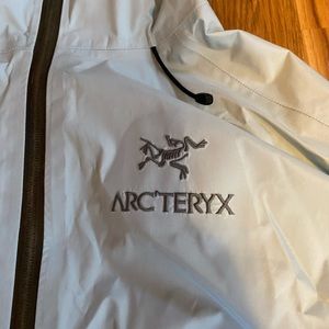 Xs Arcteryx men’s light blue rain coat! Like new